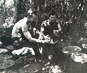 Sorting containers dropped to the camp by parachute